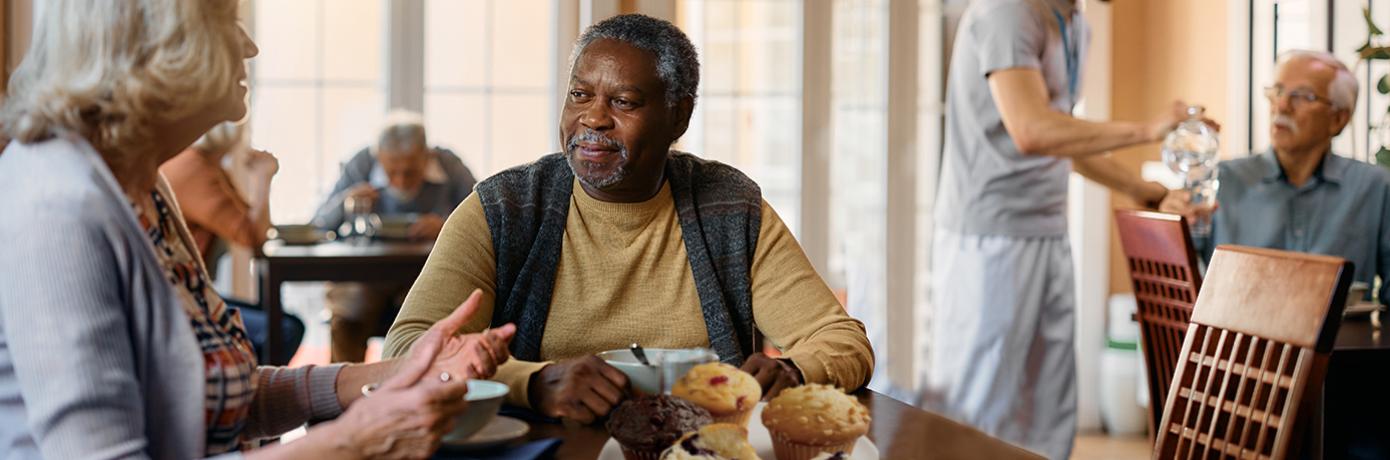 seniors enjoying baked goods and conversation