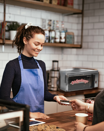 employee selling cookies at counter