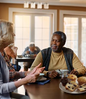 seniors enjoying baked goods and conversation