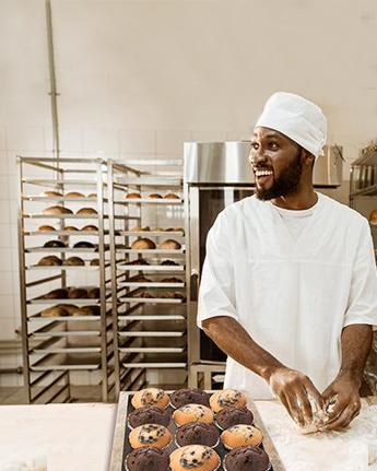 baker working with dough