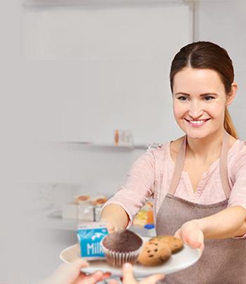 cafeteria worker serving student food